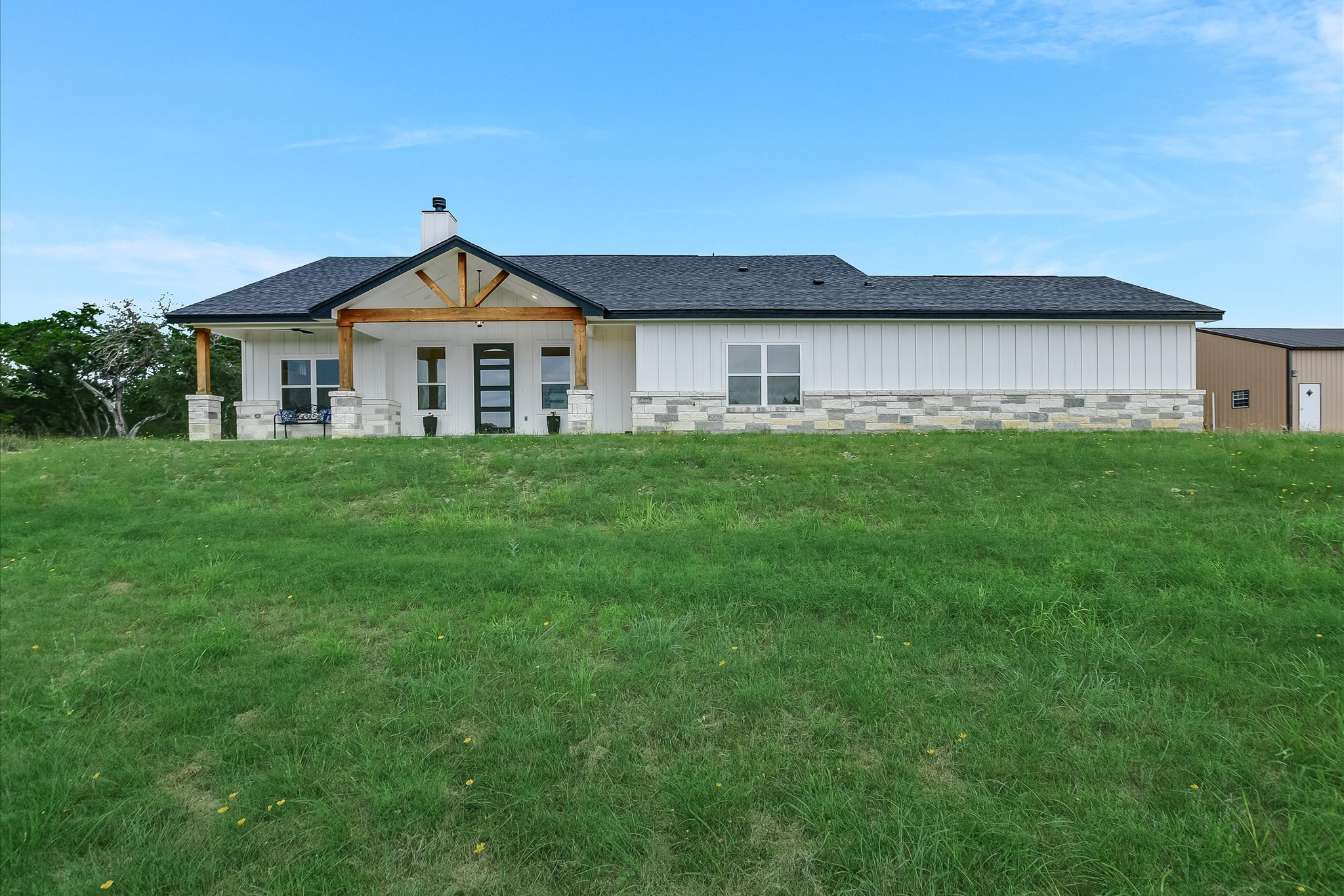 Welcome home to your covered front patio and big xeriscaped yard