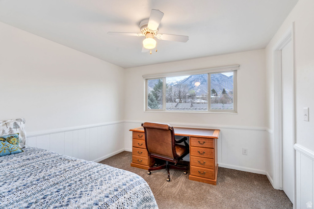 3221 North Shadowbrook Circle Provo, UT 84604 - Photo 14 of 29 Bedroom featuring wainscoting, dark carpet, and ceiling fan