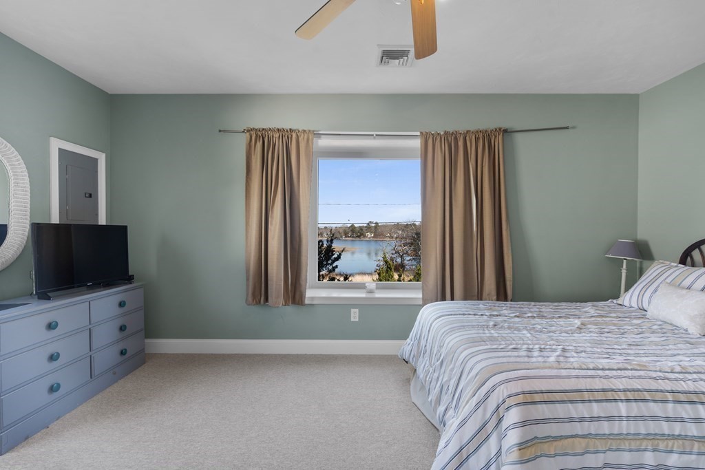 28 North Boulevard Wareham, MA 02558 - Photo 14 of 26 a bedroom with a bed and a flat screen tv