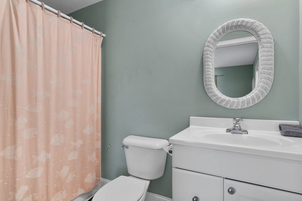 28 North Boulevard Wareham, MA 02558 - Photo 15 of 26 a bathroom with a sink mirror and toilet
