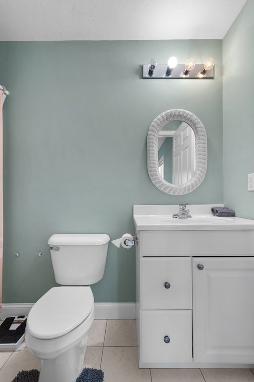 28 North Boulevard Wareham, MA 02558 - Photo 16 of 26 a bathroom with a toilet sink and mirror