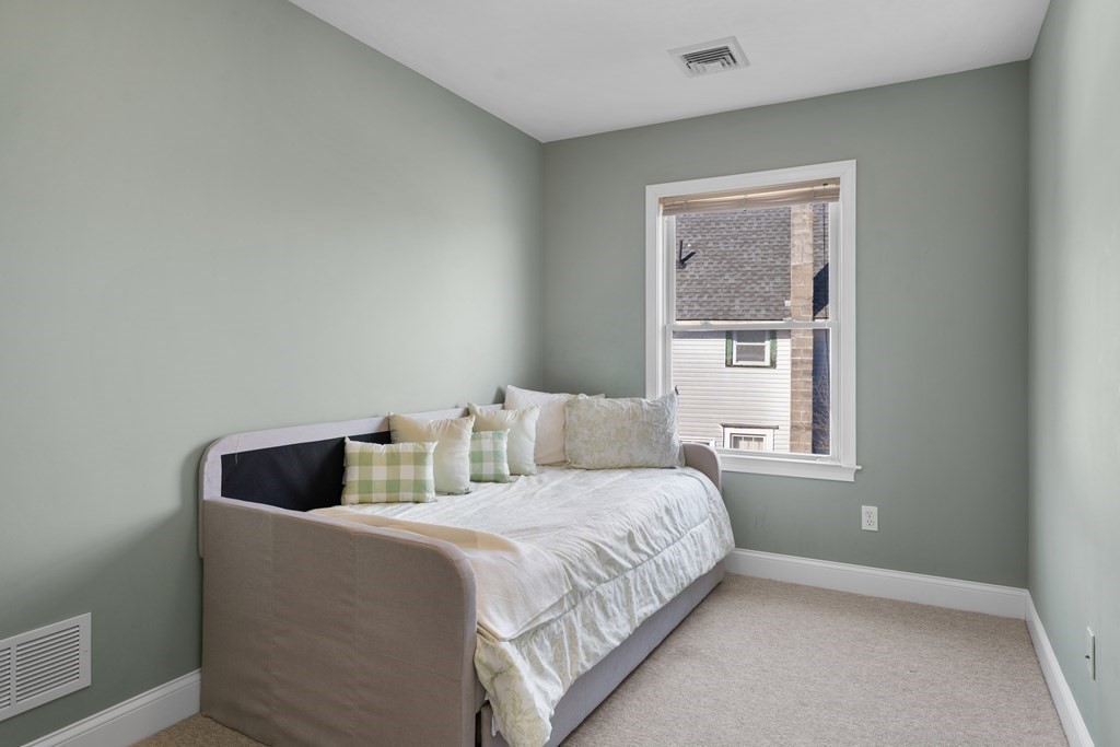 28 North Boulevard Wareham, MA 02558 - Photo 17 of 26 a bed room with a bed and two window