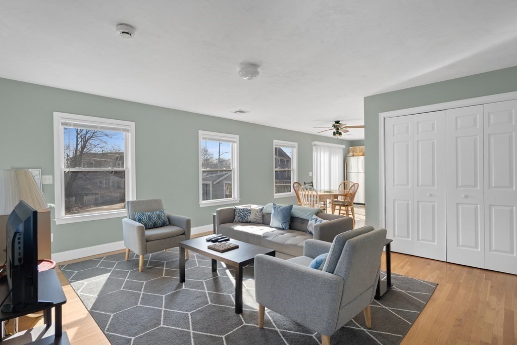 28 North Boulevard Wareham, MA 02558 - Photo 4 of 26 a living room with furniture a rug and a window