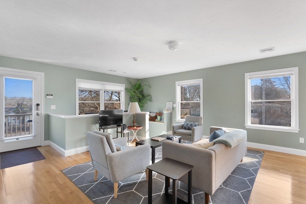 28 North Boulevard Wareham, MA 02558 - Photo 5 of 26 a living room with furniture a large window and wooden floor