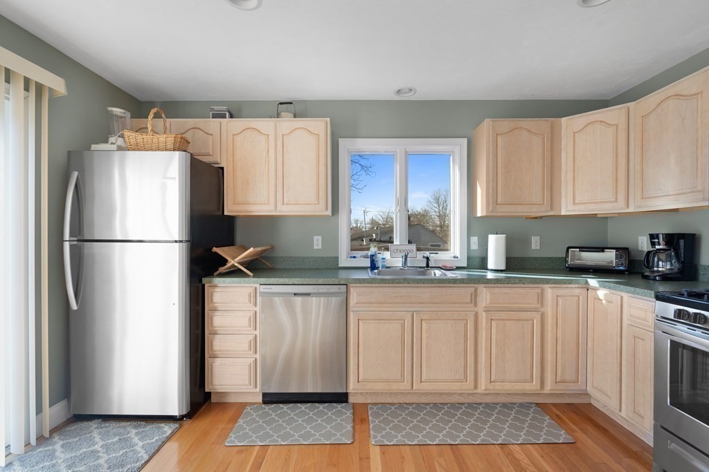 28 North Boulevard Wareham, MA 02558 - Photo 10 of 26 a kitchen with a refrigerator and a sink