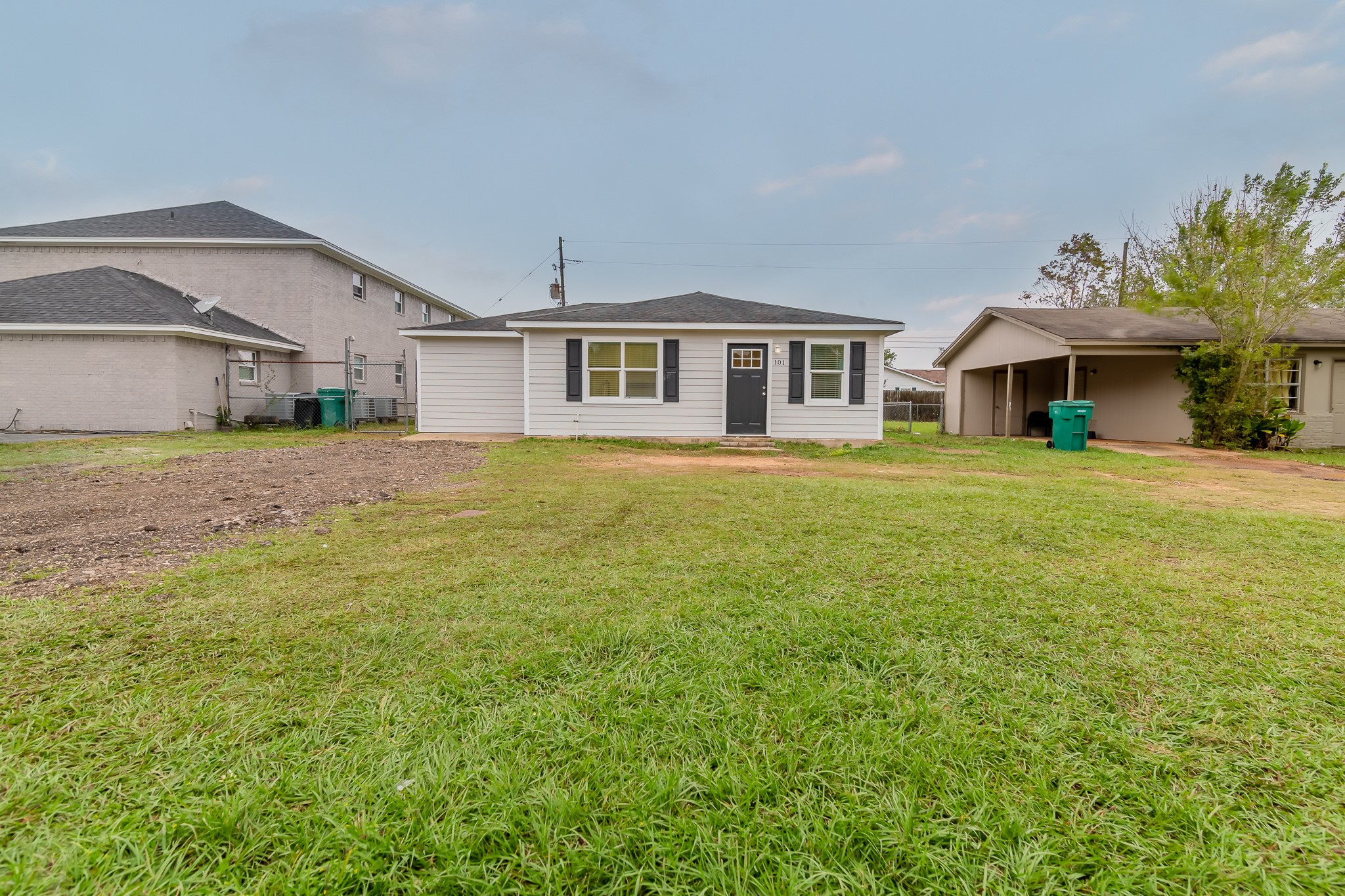 101 Will Street Willis, TX 77378 - Photo 1 of 25 a front view of a house with a yard