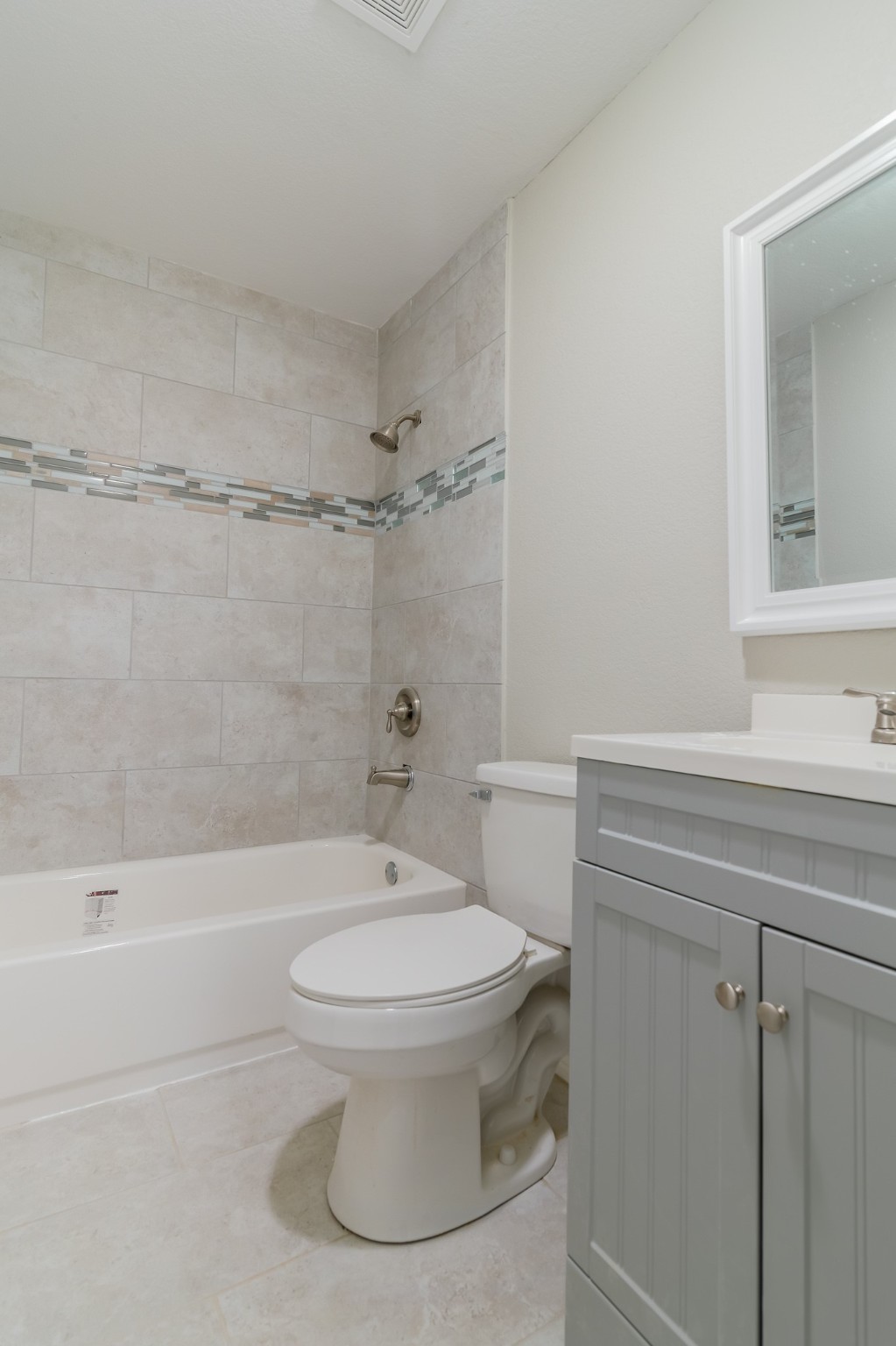 101 Will Street Willis, TX 77378 - Photo 17 of 25 a bathroom with a sink a toilet and a bathtub