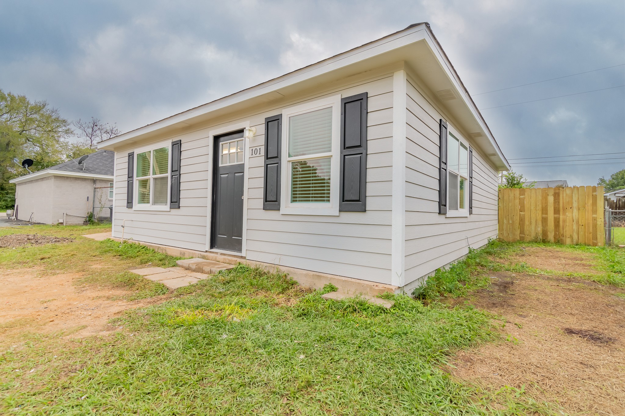 101 Will Street Willis, TX 77378 - Photo 24 of 25 a view of a house with a backyard