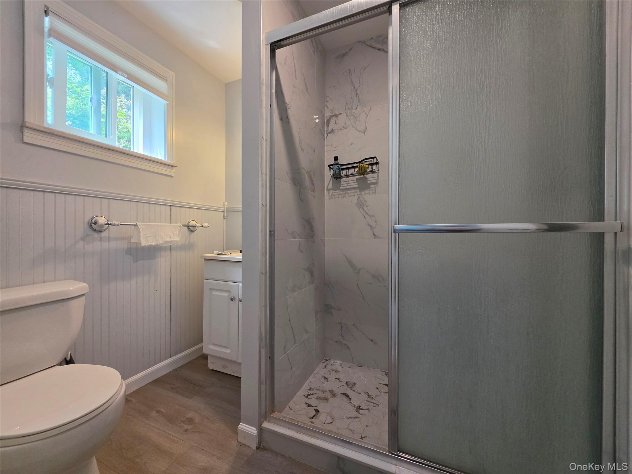 4804 Country Club Road Vestal, NY 13850 - Photo 11 of 15 a bathroom with a toilet and shower