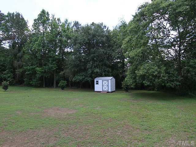 206 Howard Road Fuquay-Varina, NC 27526 - Photo 11 of 12 LARGE BACKYARD WITH A BIG STORAGE SHED THAT CONVEYS WITH THE PROPERTY. PERFECT TO STORE YOUR LAWN MOWER.