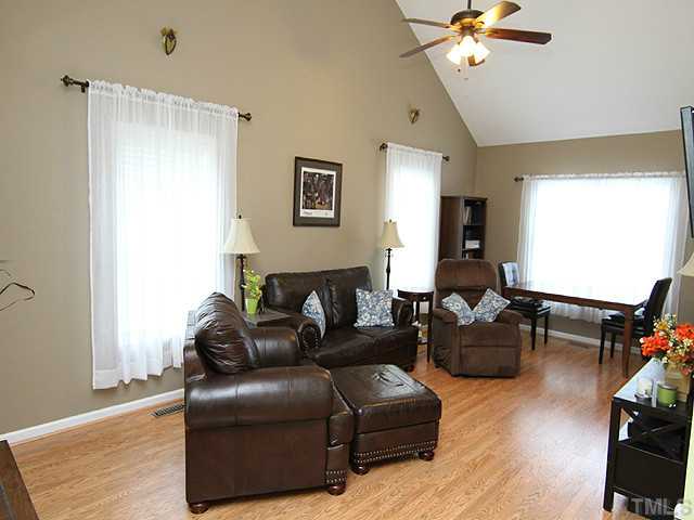 206 Howard Road Fuquay-Varina, NC 27526 - Photo 2 of 12 LARGE LIVING ROOM WITH PERGO FLOOR AND LOTS OF SUNLIGHT