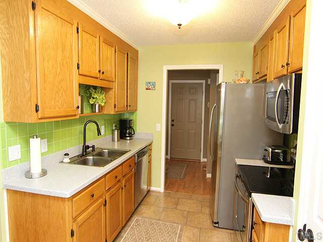 206 Howard Road Fuquay-Varina, NC 27526 - Photo 4 of 12 NICE CLEAN KITCHEN WITH STAINLESS STEEL APPLIANCES