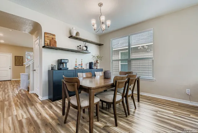 a view of a dining room with furniture and window