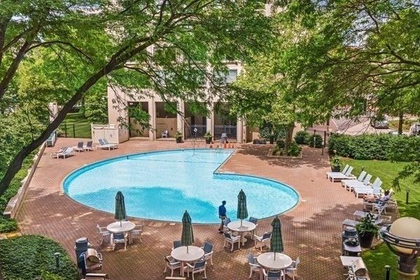a view of a swimming pool with a patio