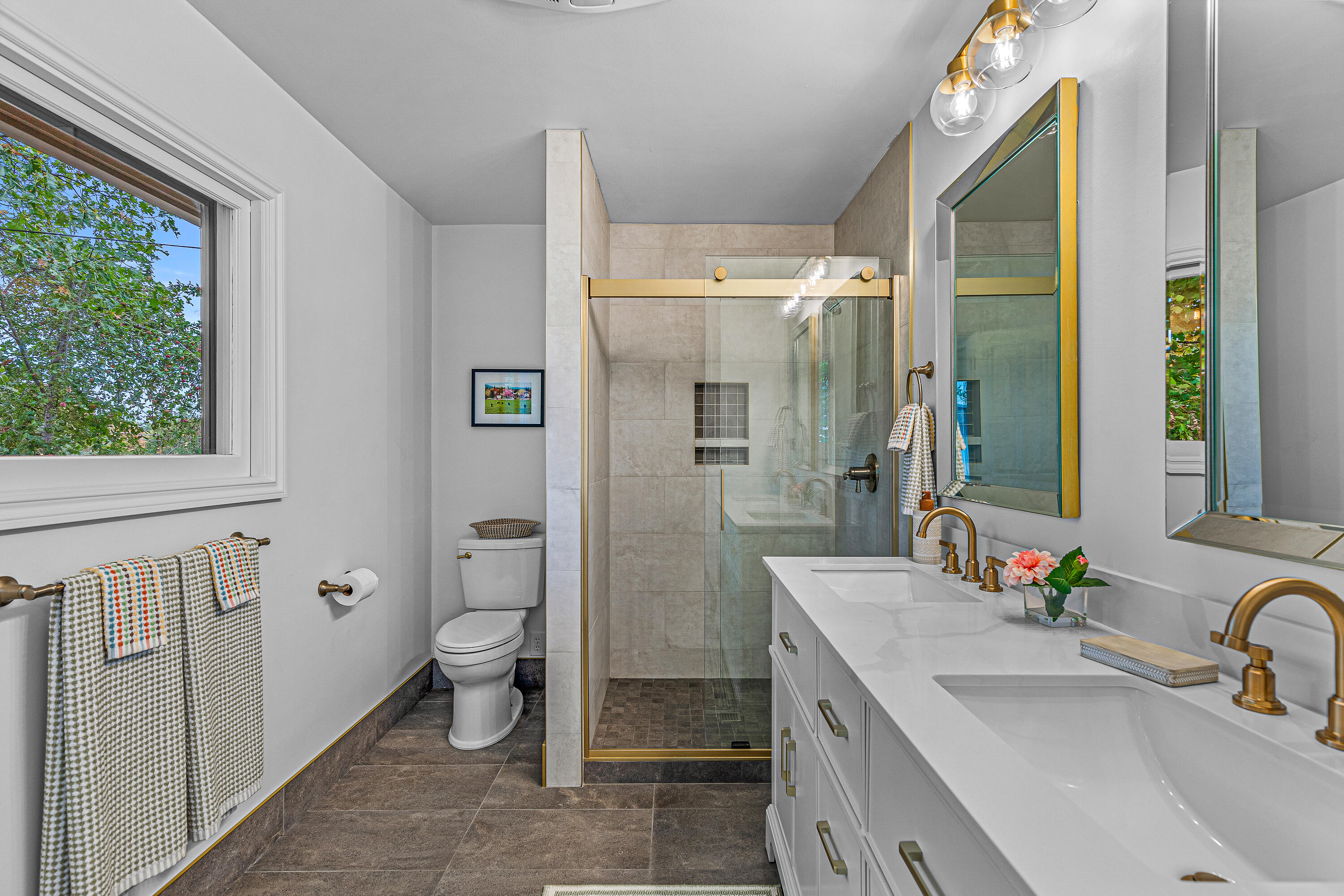 1865 Old Military Road Central Point, OR 97502 - Photo 29 of 77 a bathroom with a double vanity sink toilet and shower