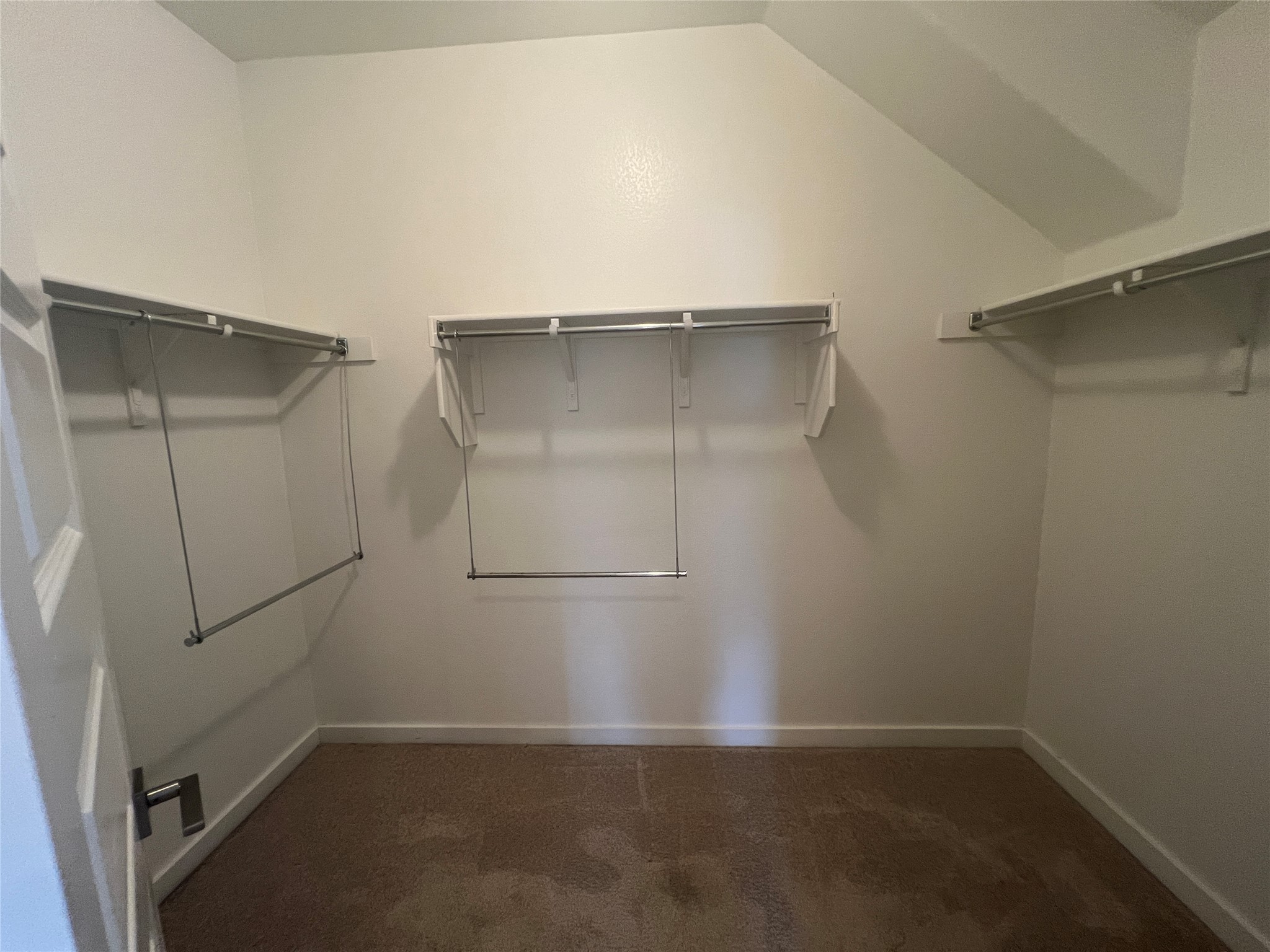 7009 Sienna Rouge Path Austin, TX 78744 - Photo 12 of 29 Walk in closet with dark colored carpet