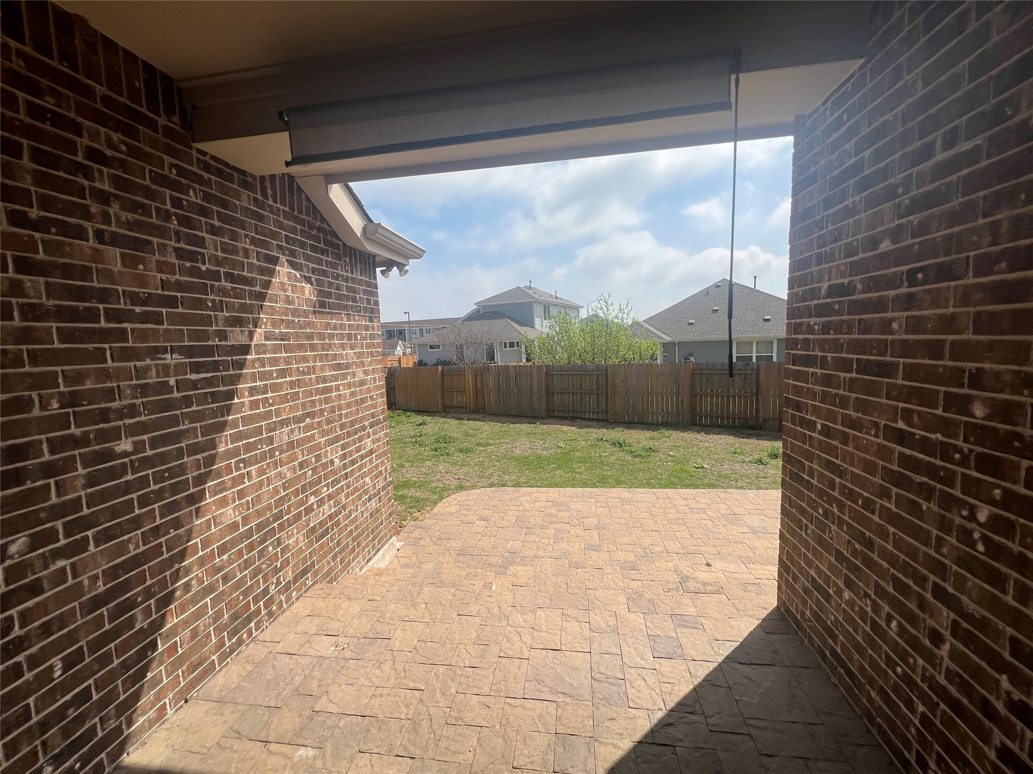 7009 Sienna Rouge Path Austin, TX 78744 - Photo 17 of 29 Fenced backyard featuring a patio