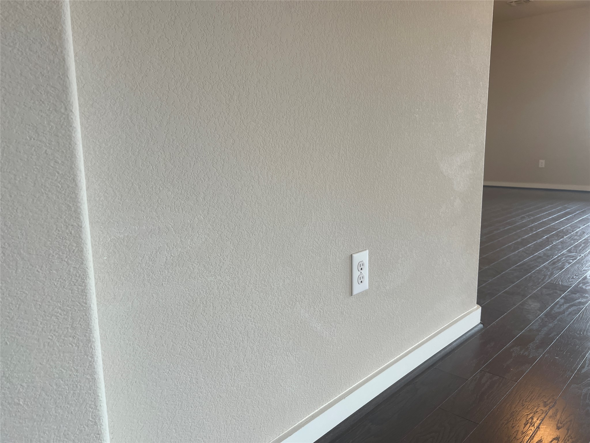7009 Sienna Rouge Path Austin, TX 78744 - Photo 26 of 29 Detailed view of wood finished floors and a textured wall