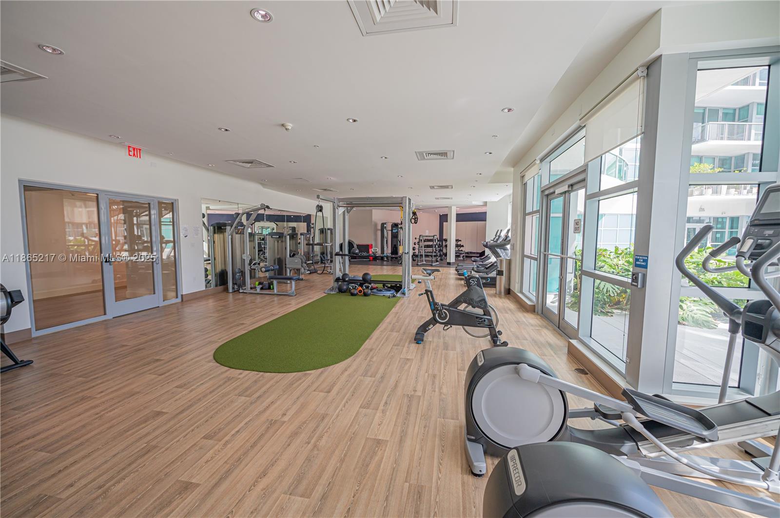 3301 Northeast 1st Avenue, Unit M0703 Miami, FL 33137 - Photo 16 of 48 a room with lots of furniture and wooden floor