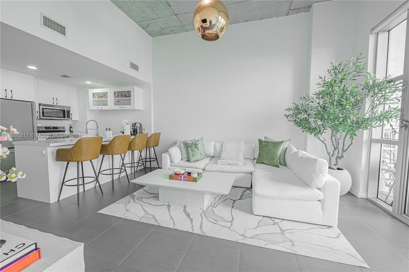 3301 Northeast 1st Avenue, Unit M0703 Miami, FL 33137 - Photo 19 of 48 a living room with furniture and a table