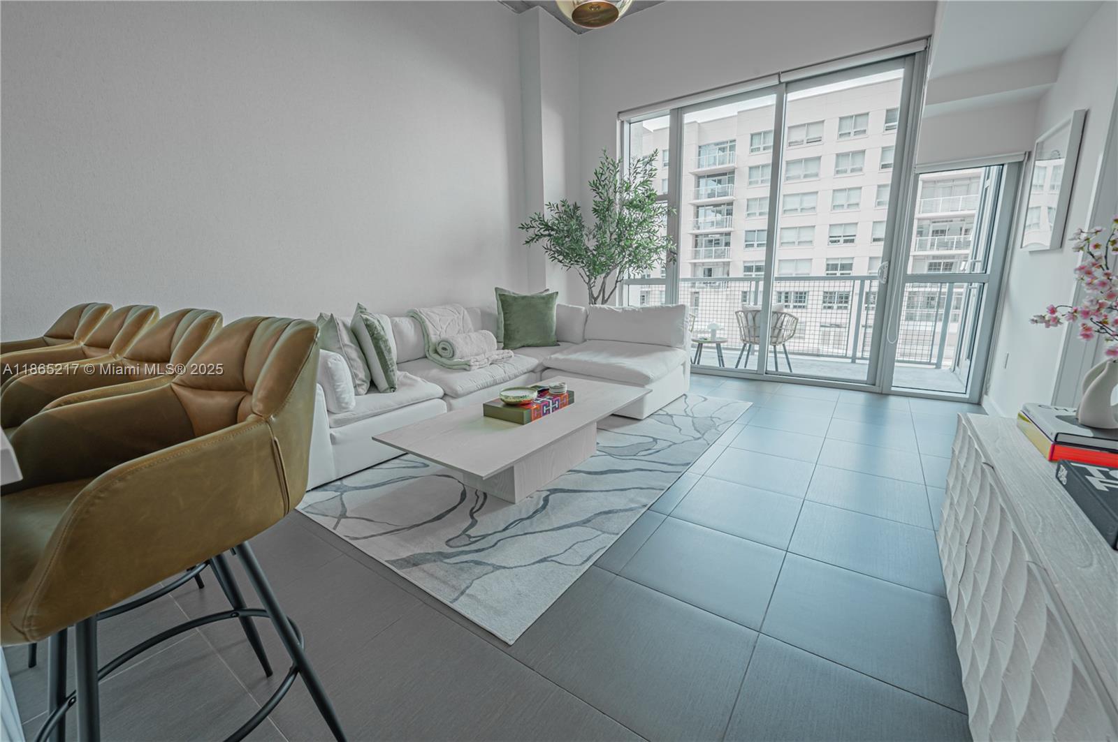 3301 Northeast 1st Avenue, Unit M0703 Miami, FL 33137 - Photo 20 of 48 a living room with furniture and a window