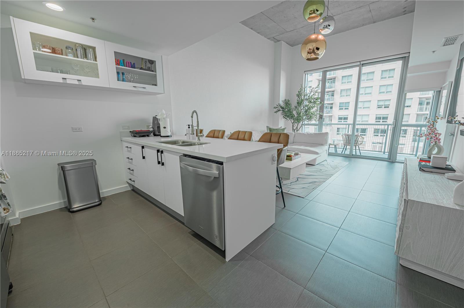 3301 Northeast 1st Avenue, Unit M0703 Miami, FL 33137 - Photo 22 of 48 a kitchen with a sink and living room