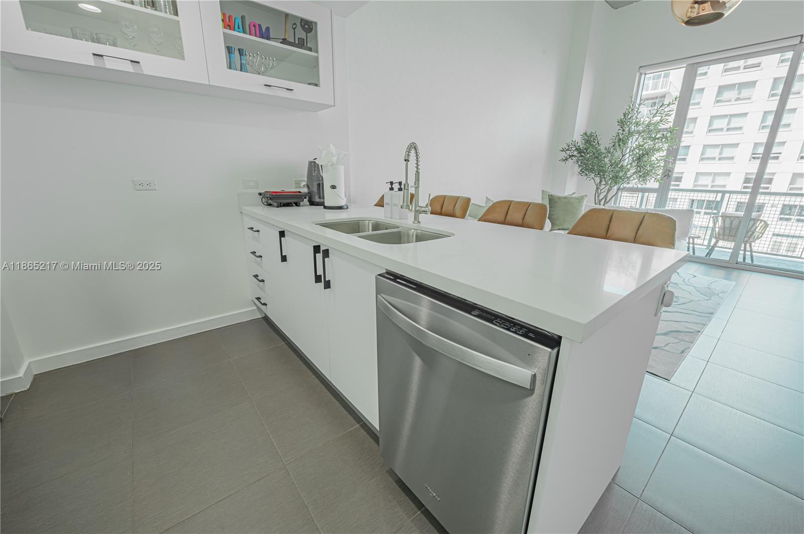 3301 Northeast 1st Avenue, Unit M0703 Miami, FL 33137 - Photo 24 of 48 a view of a storage and utility room with washer and dryer