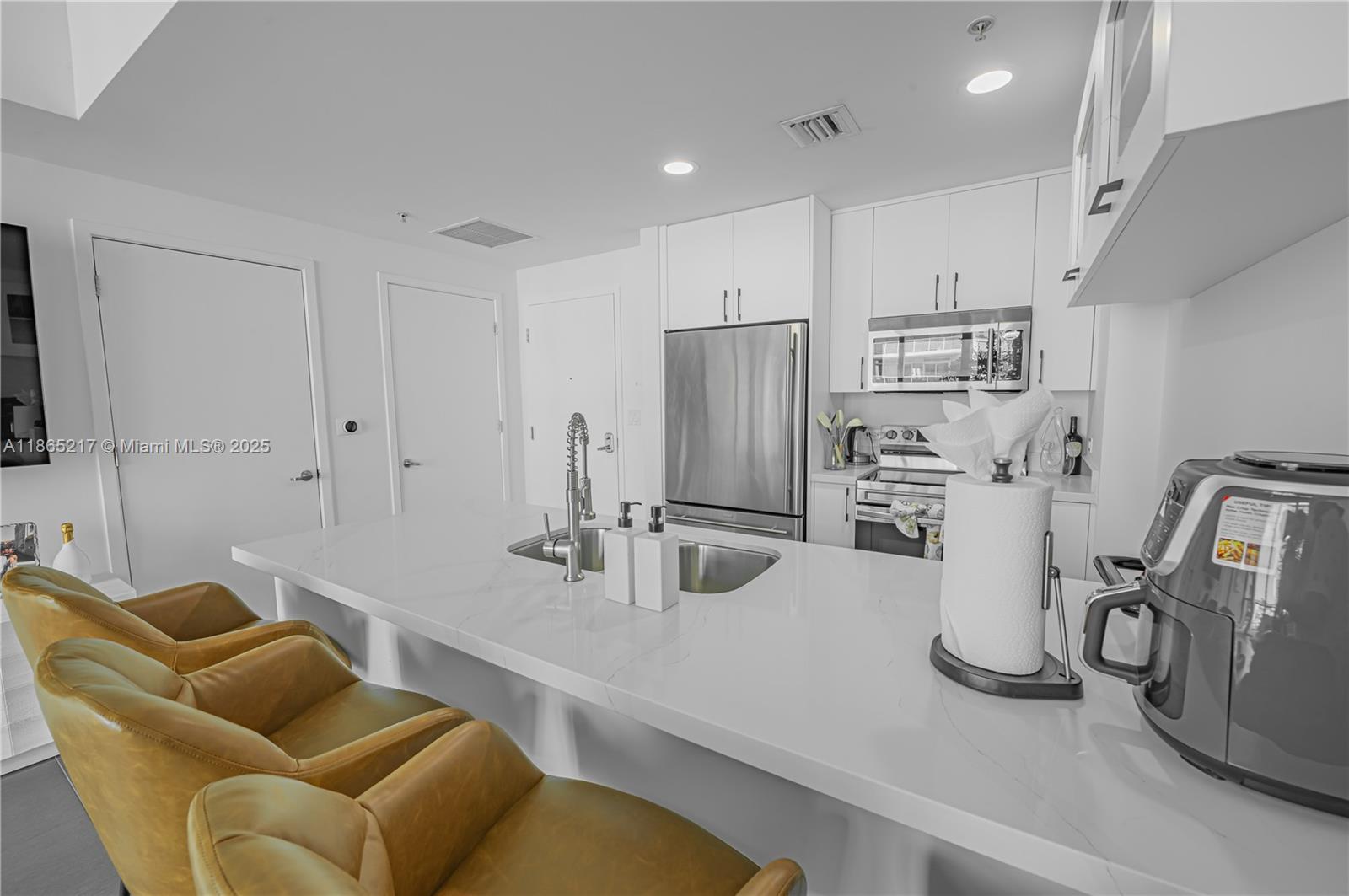 3301 Northeast 1st Avenue, Unit M0703 Miami, FL 33137 - Photo 26 of 48 a kitchen with refrigerator and washing machine