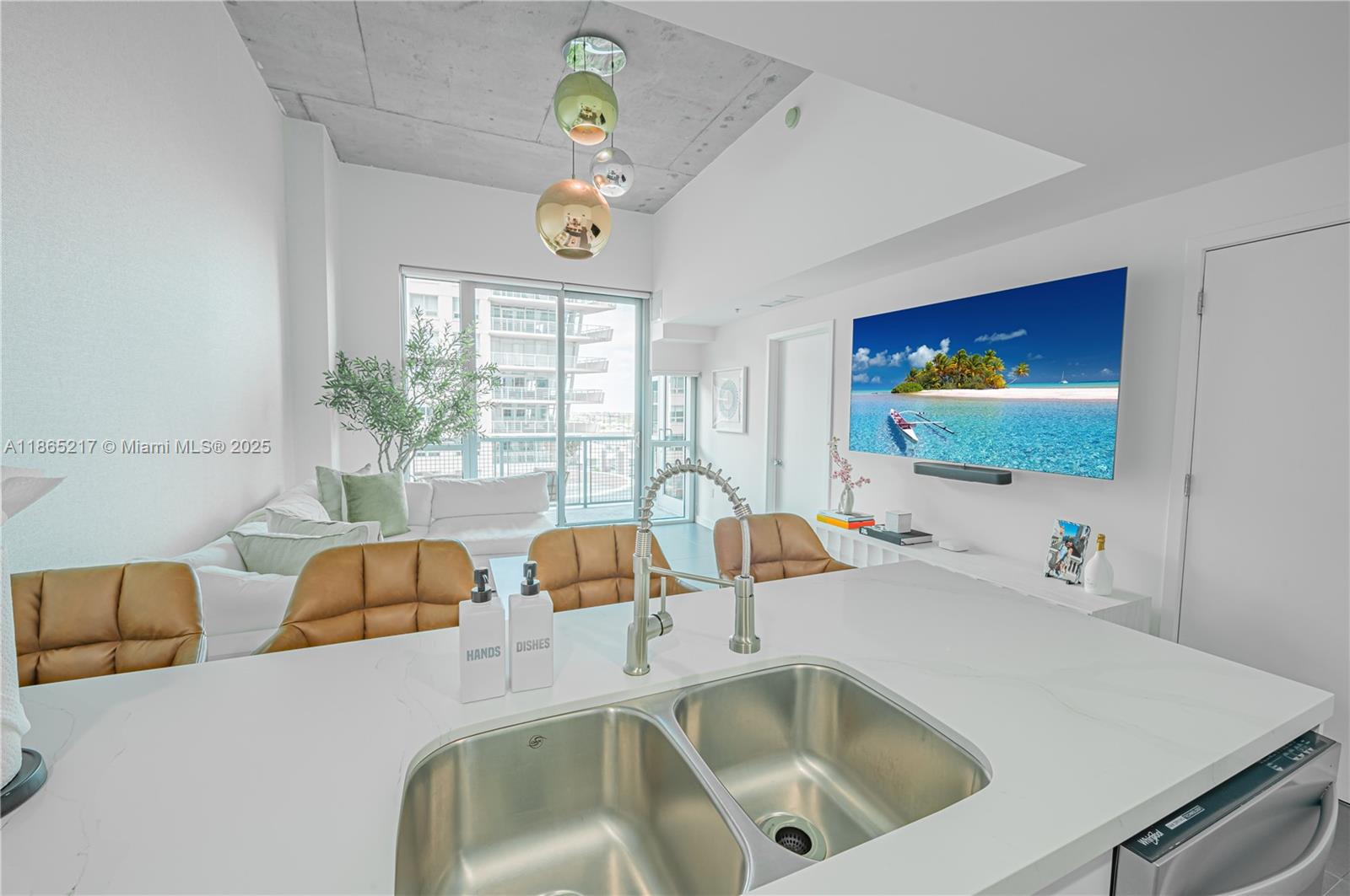 3301 Northeast 1st Avenue, Unit M0703 Miami, FL 33137 - Photo 29 of 48 a kitchen with a table chairs and a bed