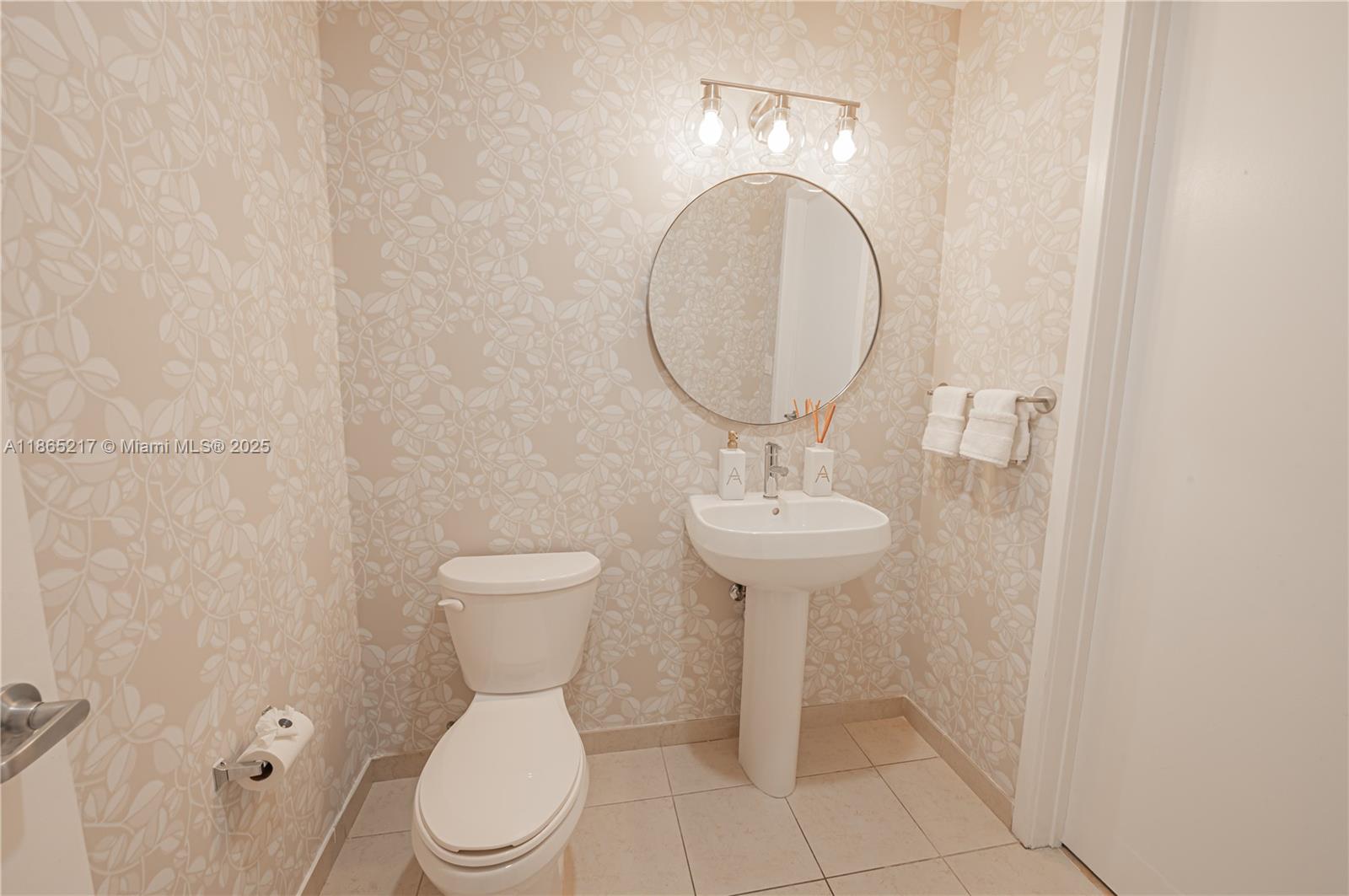 3301 Northeast 1st Avenue, Unit M0703 Miami, FL 33137 - Photo 36 of 48 a bathroom with a toilet sink and mirror