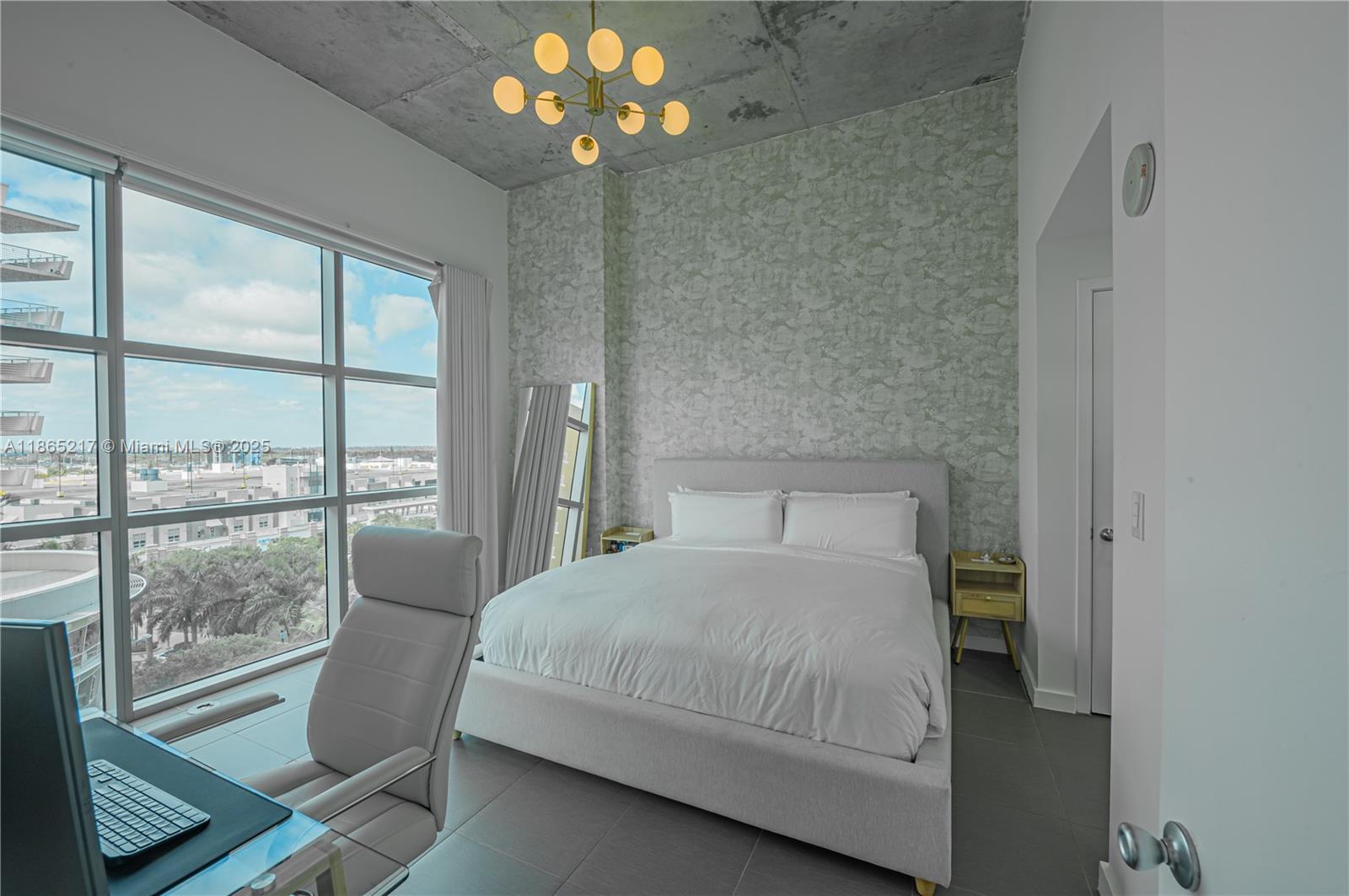 3301 Northeast 1st Avenue, Unit M0703 Miami, FL 33137 - Photo 38 of 48 a bedroom with a bed and a large window