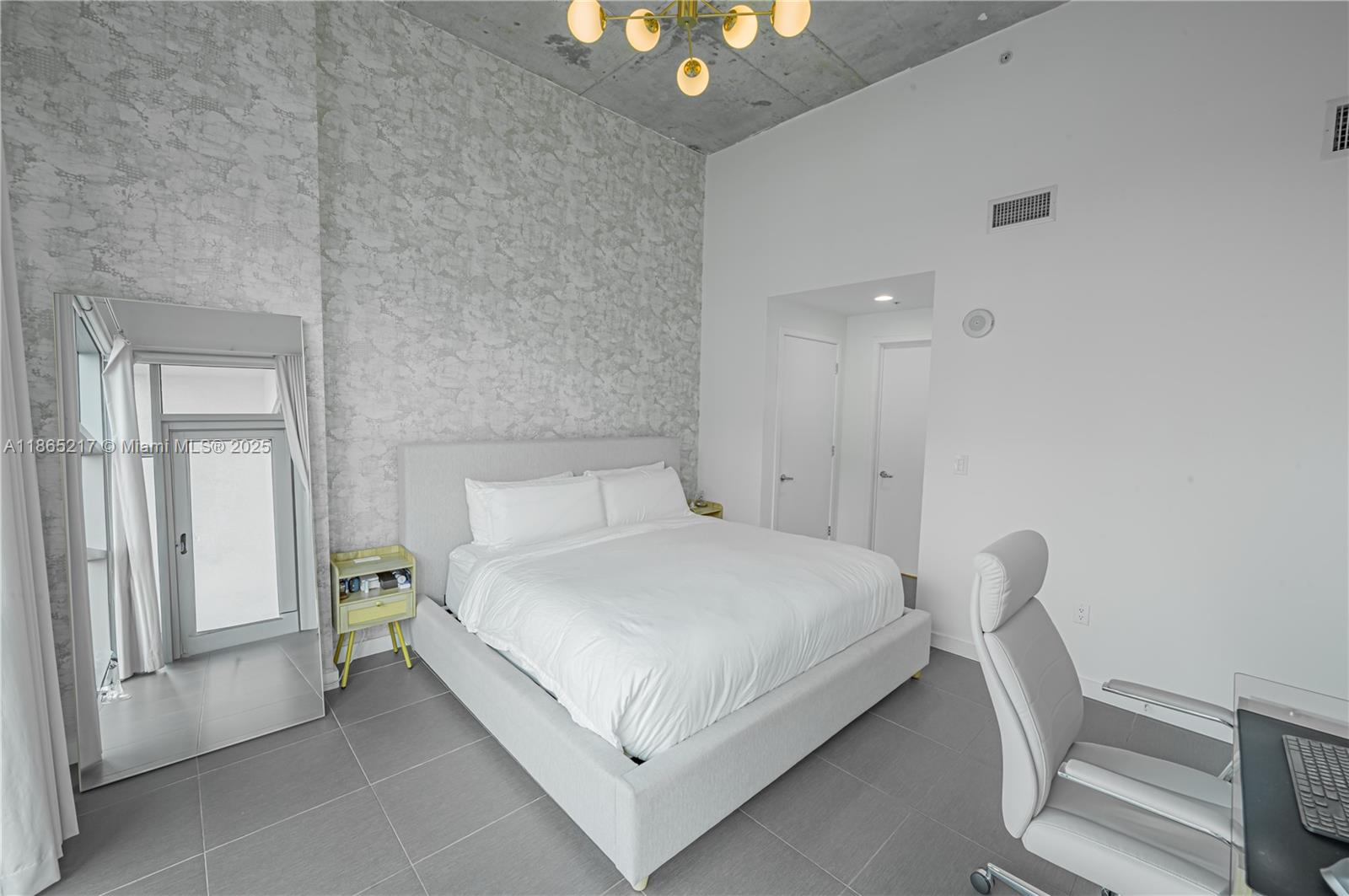 3301 Northeast 1st Avenue, Unit M0703 Miami, FL 33137 - Photo 39 of 48 a bedroom with a bed and a window