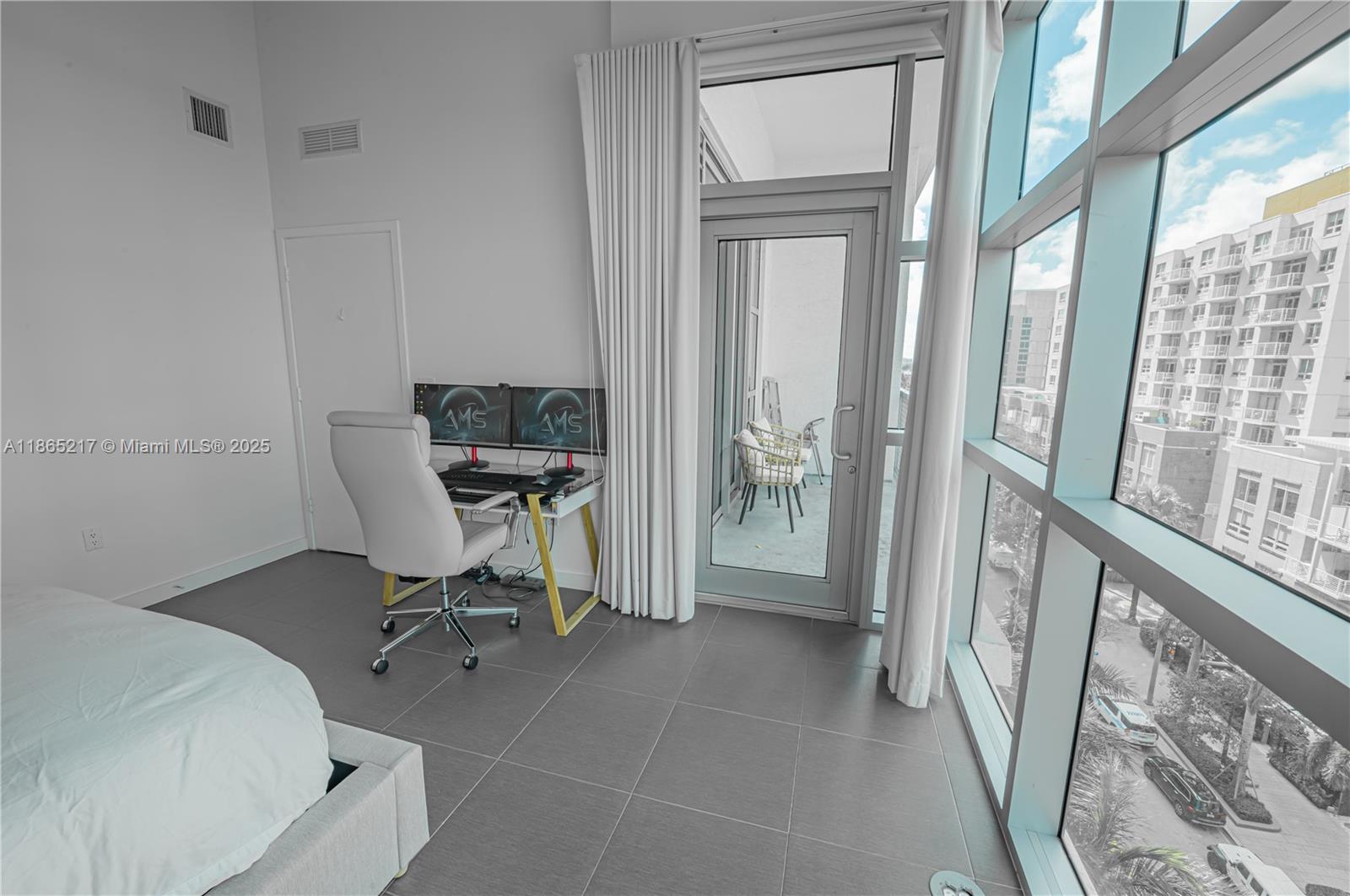 3301 Northeast 1st Avenue, Unit M0703 Miami, FL 33137 - Photo 44 of 48 a workspace with table and chair