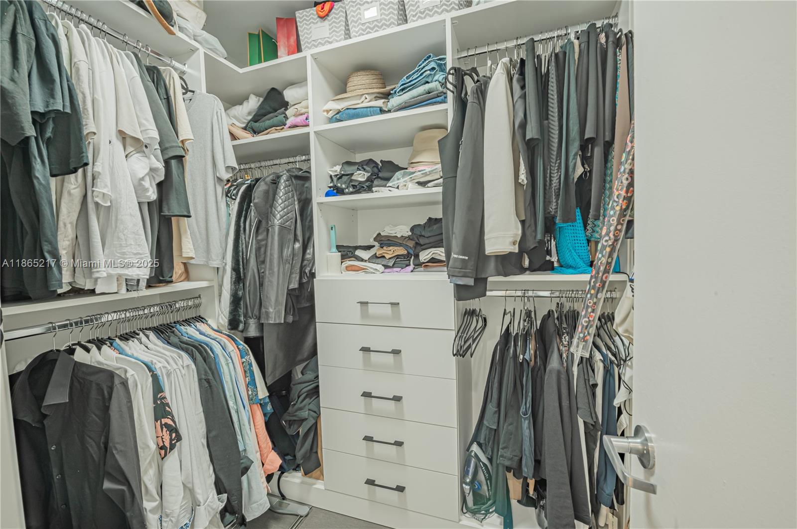 3301 Northeast 1st Avenue, Unit M0703 Miami, FL 33137 - Photo 45 of 48 a view of walk in closet with clothes and shoes
