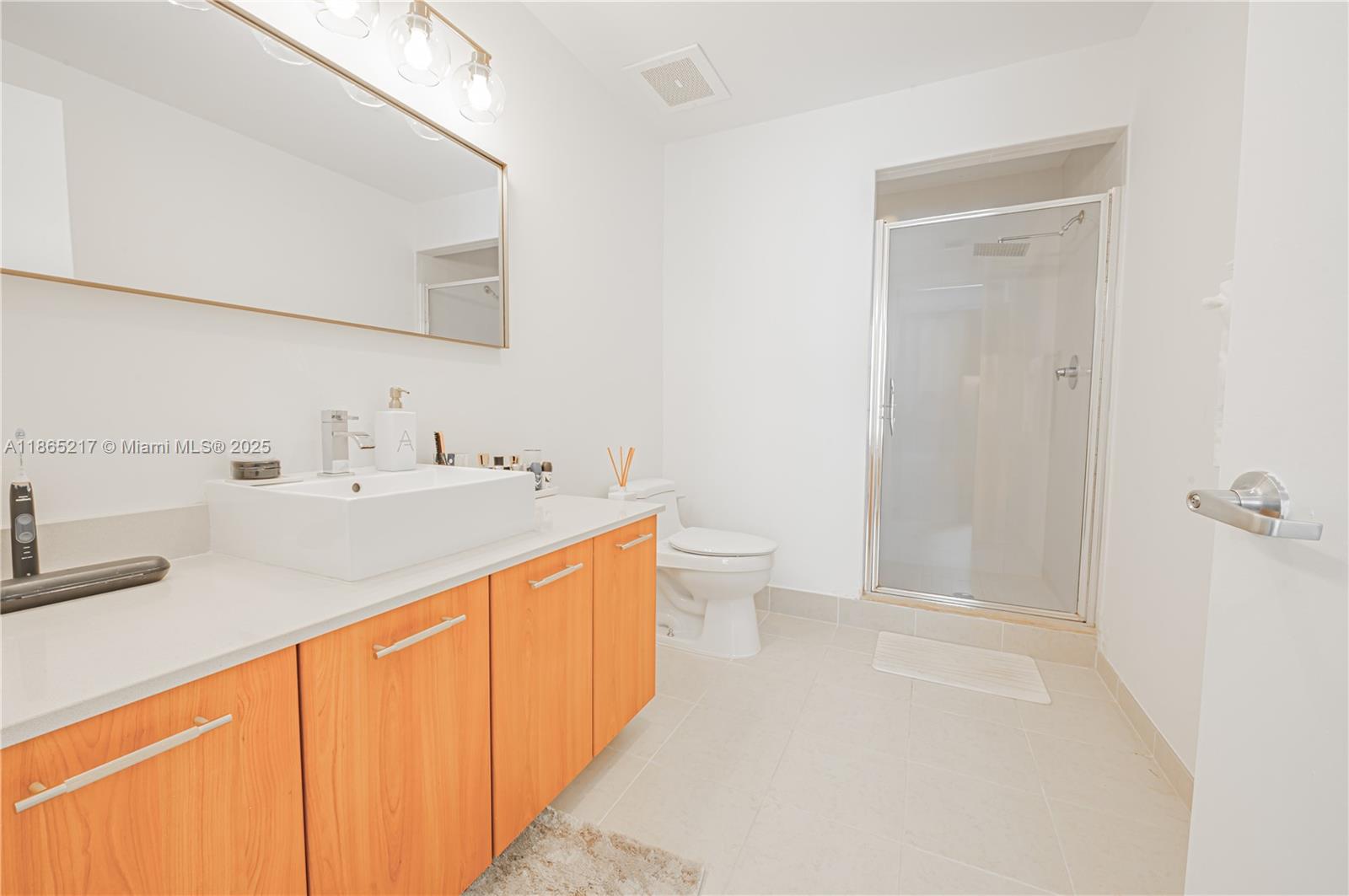 3301 Northeast 1st Avenue, Unit M0703 Miami, FL 33137 - Photo 48 of 48 a spacious bathroom with a sink a toilet and shower