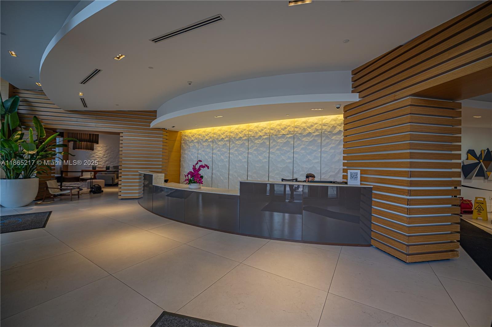 3301 Northeast 1st Avenue, Unit M0703 Miami, FL 33137 - Photo 5 of 48 a lobby with a couch and a potted plant