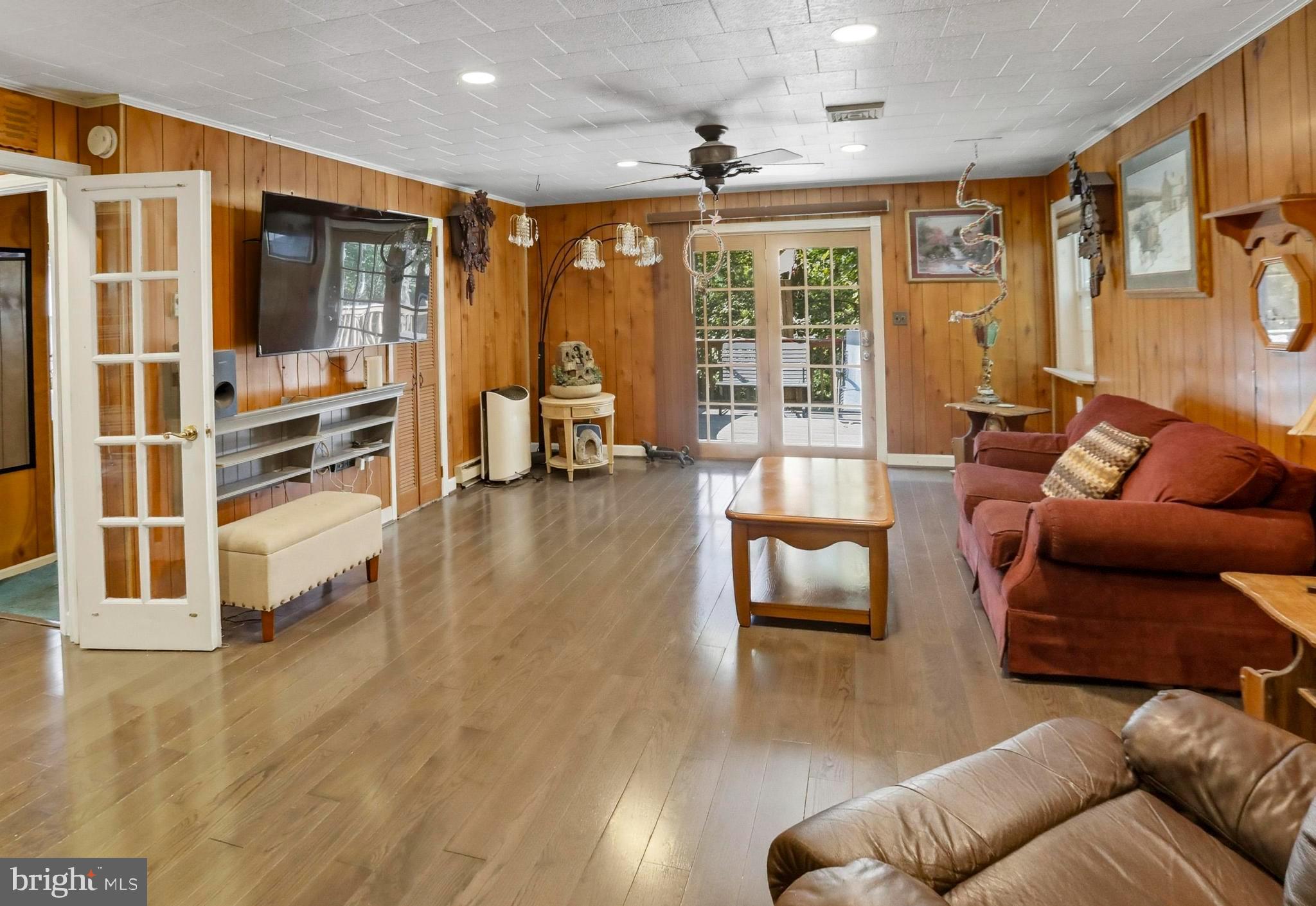 454 Landis Store Road Boyertown, PA 19512 - Photo 35 of 48 Living room with sliding doors to upper deck