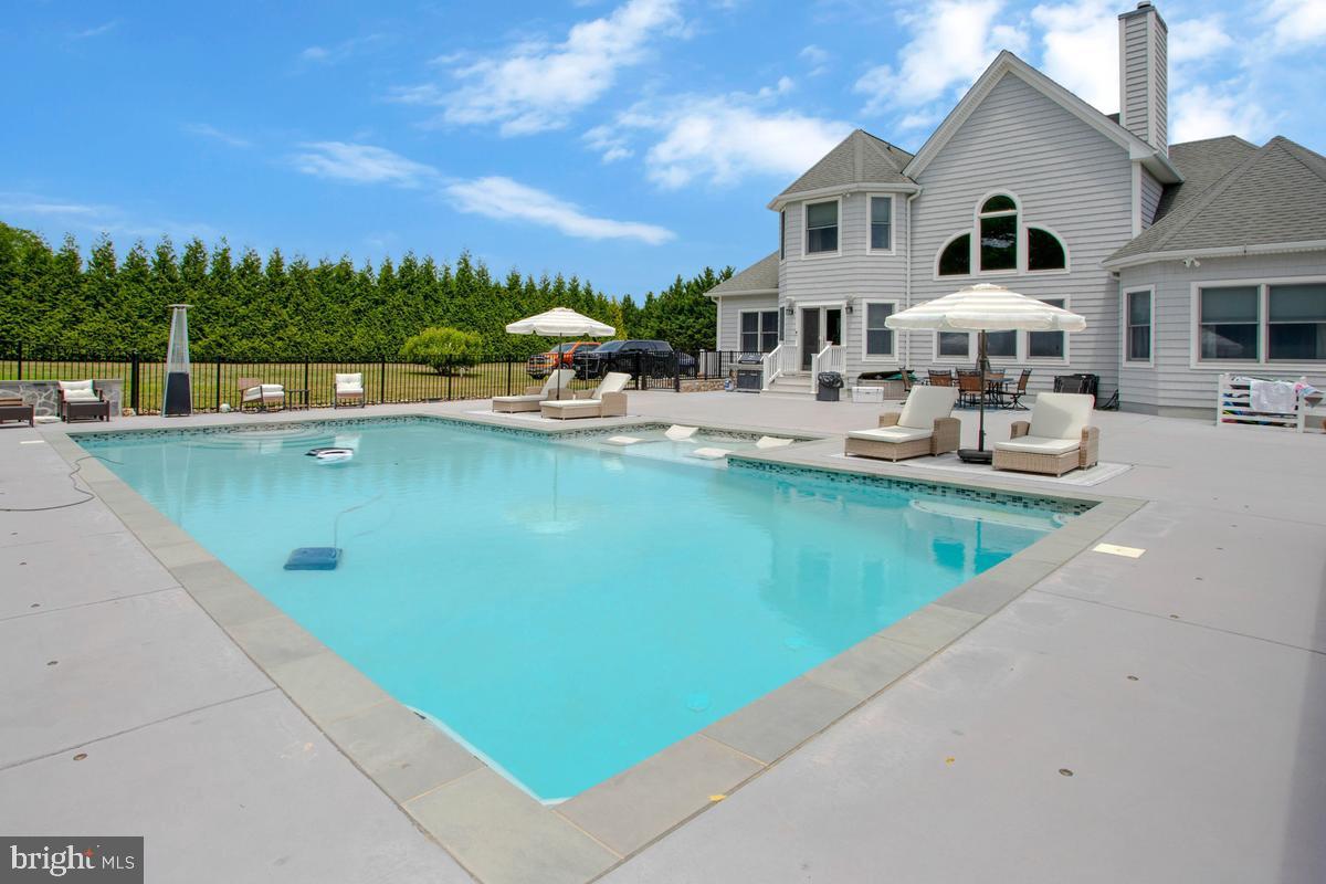 5 Jessie Road Harwood, MD 20776 - Photo 77 of 87 a front view of a house with swimming pool having outdoor seating