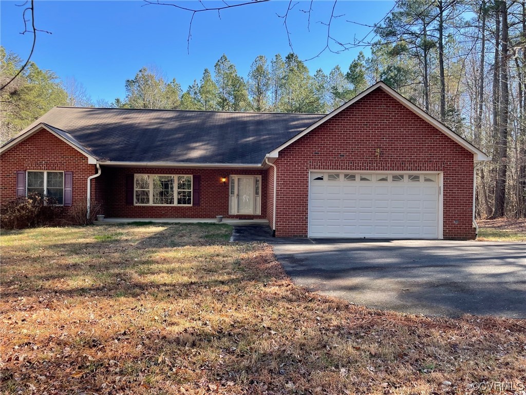 17512 Circuit Rider Drive Beaverdam, VA 23015 - Photo 1 of 19 a front view of a house with a yard and garage