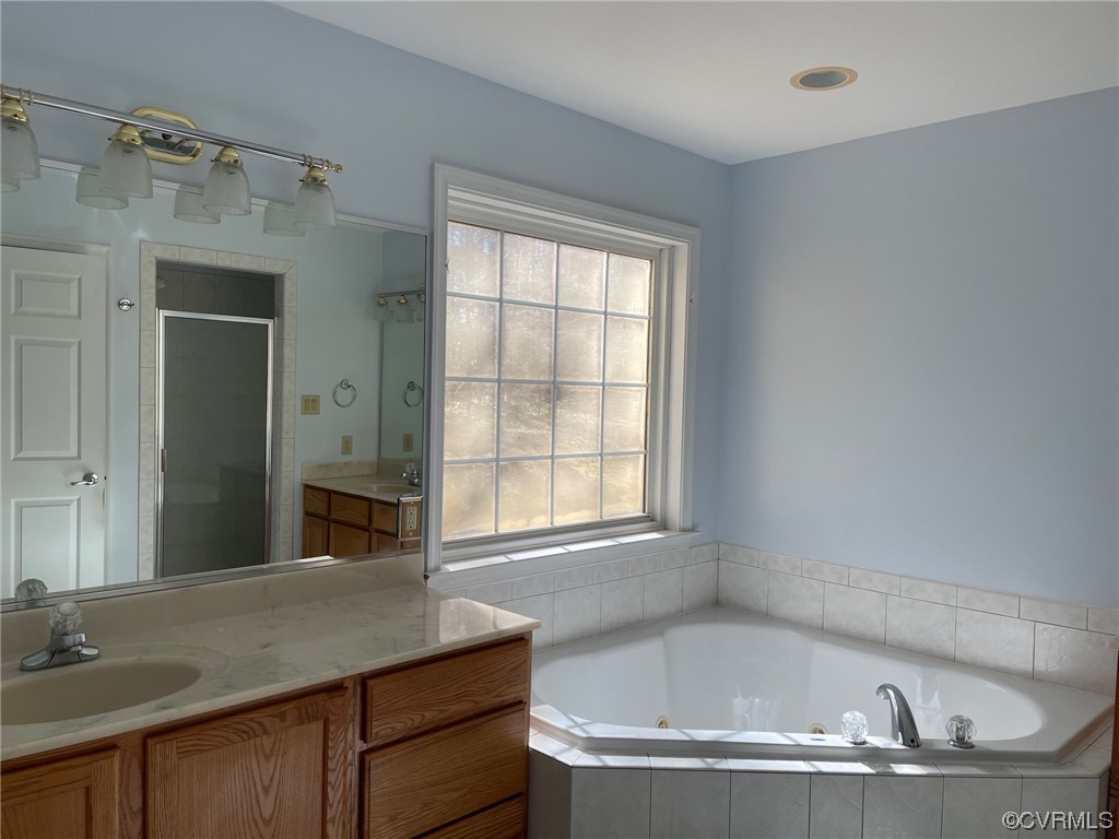17512 Circuit Rider Drive Beaverdam, VA 23015 - Photo 13 of 19 a bathroom with a granite countertop tub sink and mirror