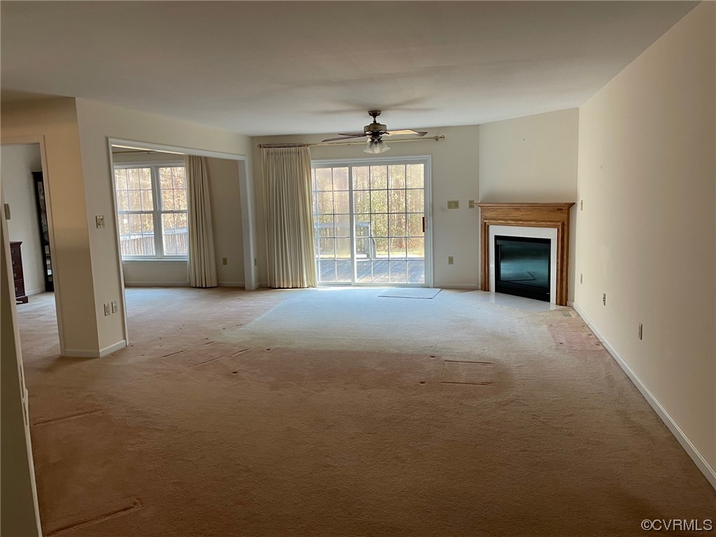 17512 Circuit Rider Drive Beaverdam, VA 23015 - Photo 5 of 19 an empty room with windows and fireplace