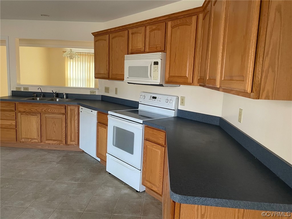 17512 Circuit Rider Drive Beaverdam, VA 23015 - Photo 8 of 19 a kitchen with stainless steel appliances granite countertop a stove a sink and a microwave