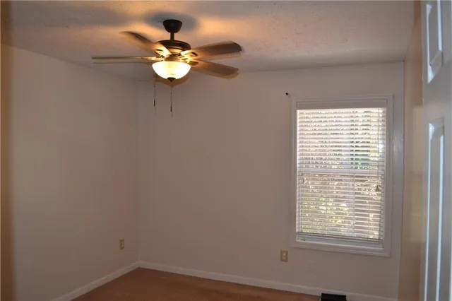 a white wall with a window