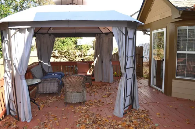 a view of two chairs in the patio