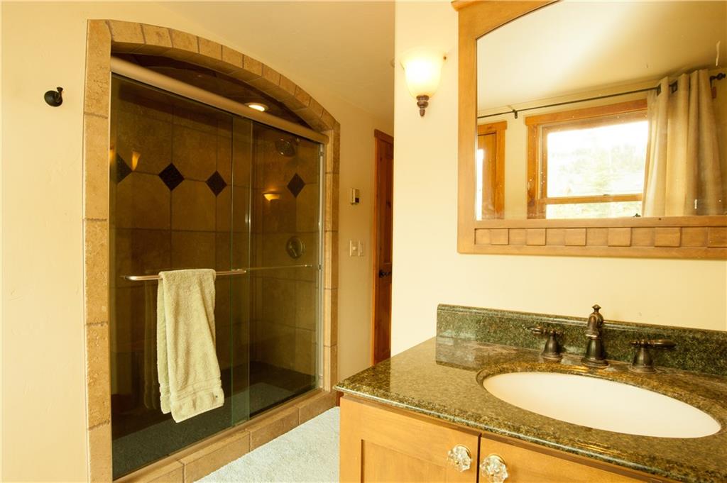 89 N Road Silverthorne, CO 80498 - Photo 13 of 35 a bathroom with a sink and a mirror