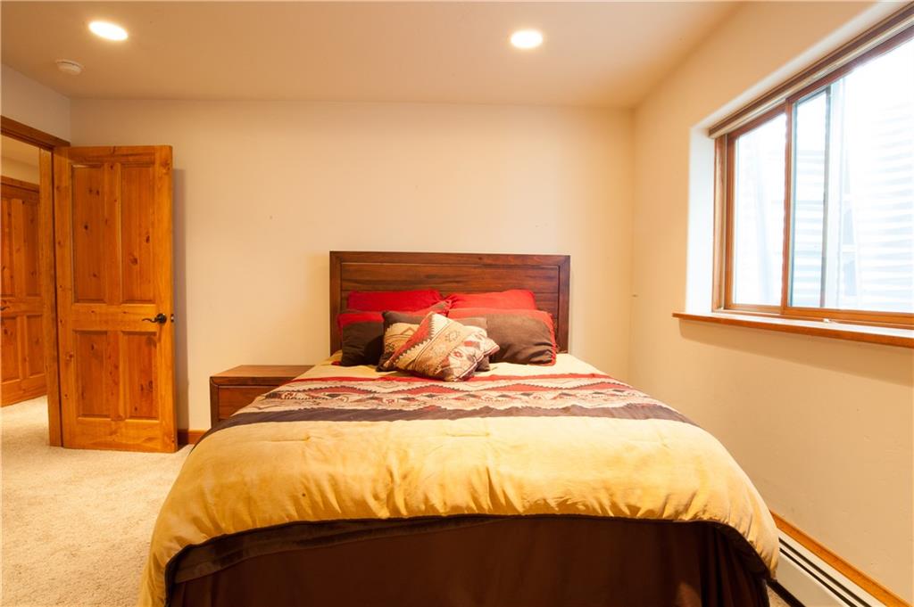 89 N Road Silverthorne, CO 80498 - Photo 19 of 35 a bedroom with a bed and a window