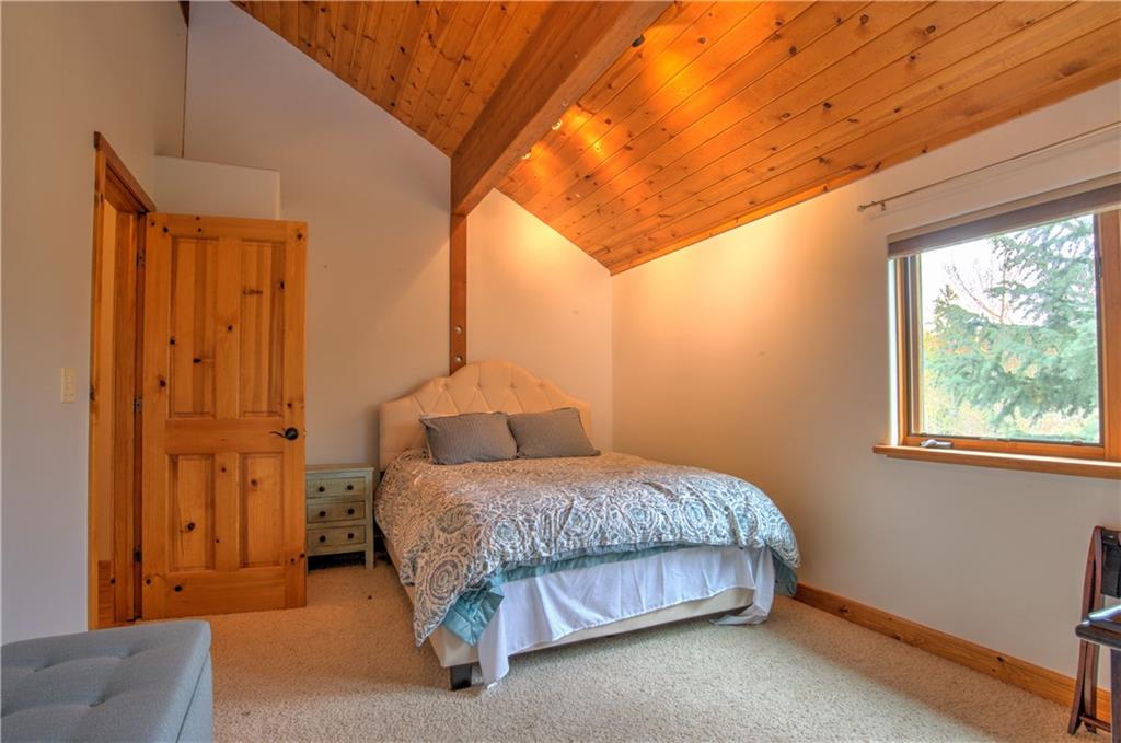 89 N Road Silverthorne, CO 80498 - Photo 25 of 35 a bedroom with a bed and a window