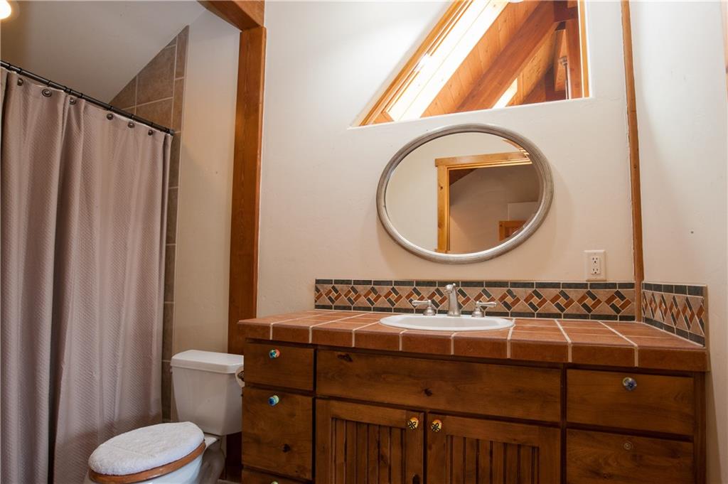 89 N Road Silverthorne, CO 80498 - Photo 26 of 35 a bathroom with a sink and a mirror