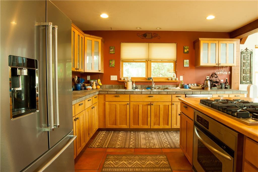 89 N Road Silverthorne, CO 80498 - Photo 5 of 35 a view of a kitchen with a sink and cabinets