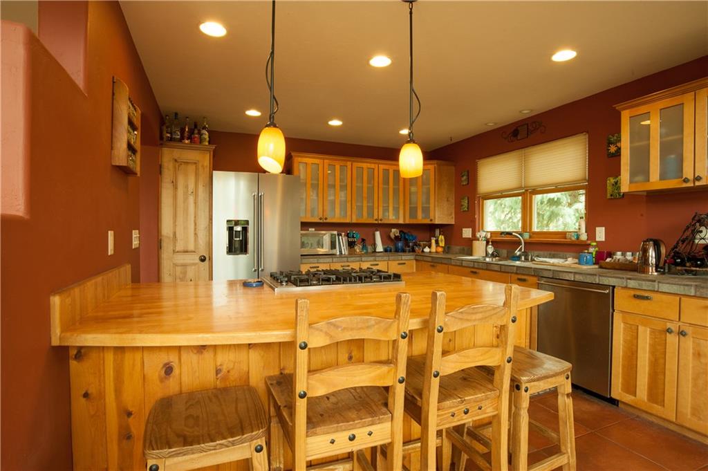 89 N Road Silverthorne, CO 80498 - Photo 7 of 35 a view of a kitchen and a chandelier